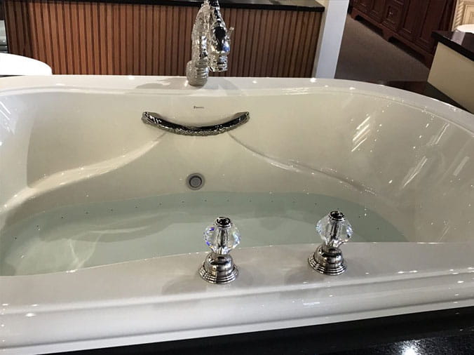 Bath tub with decorative dragon faucet at Weinstein Supply Willow Grove