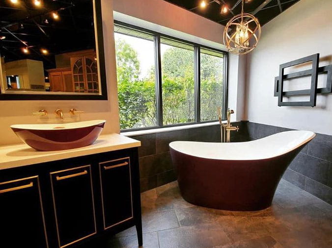 Red sink and bathtub at Weinstein Supply Willow Grove